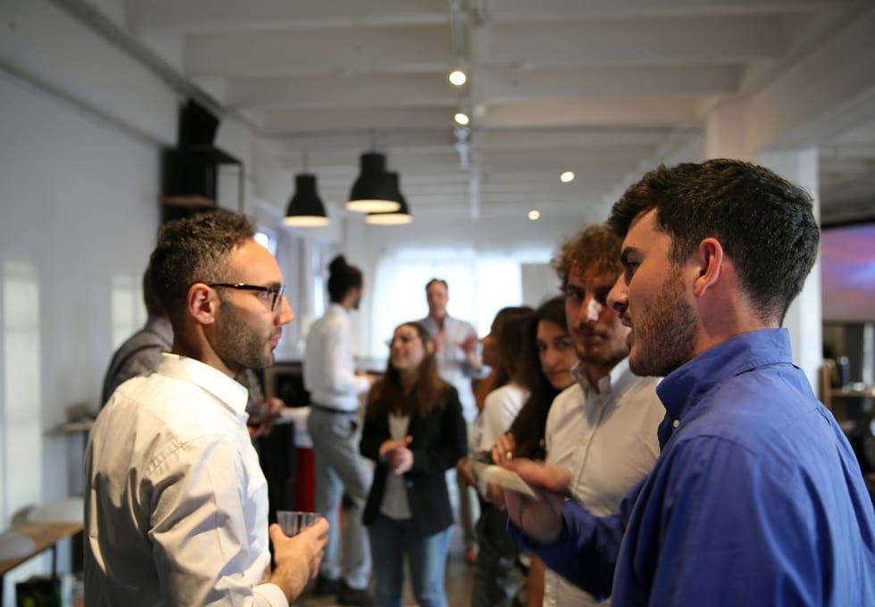 No Cants members talking at a networking event